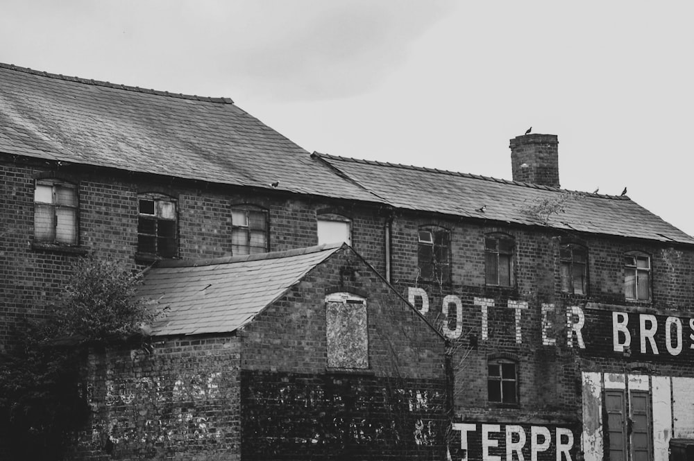 a black and white photo of an old brick building