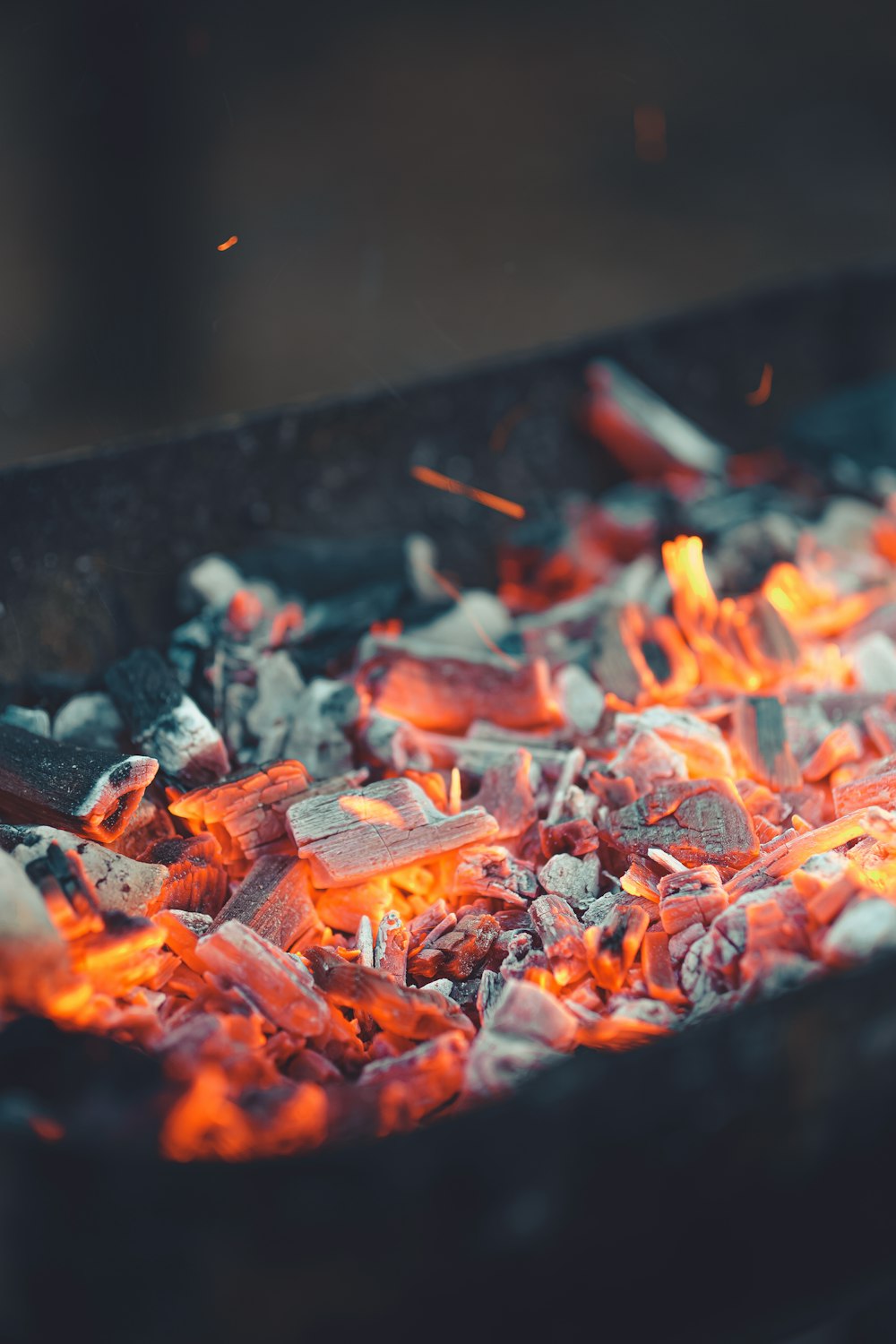 a close up of a grill with hot coal