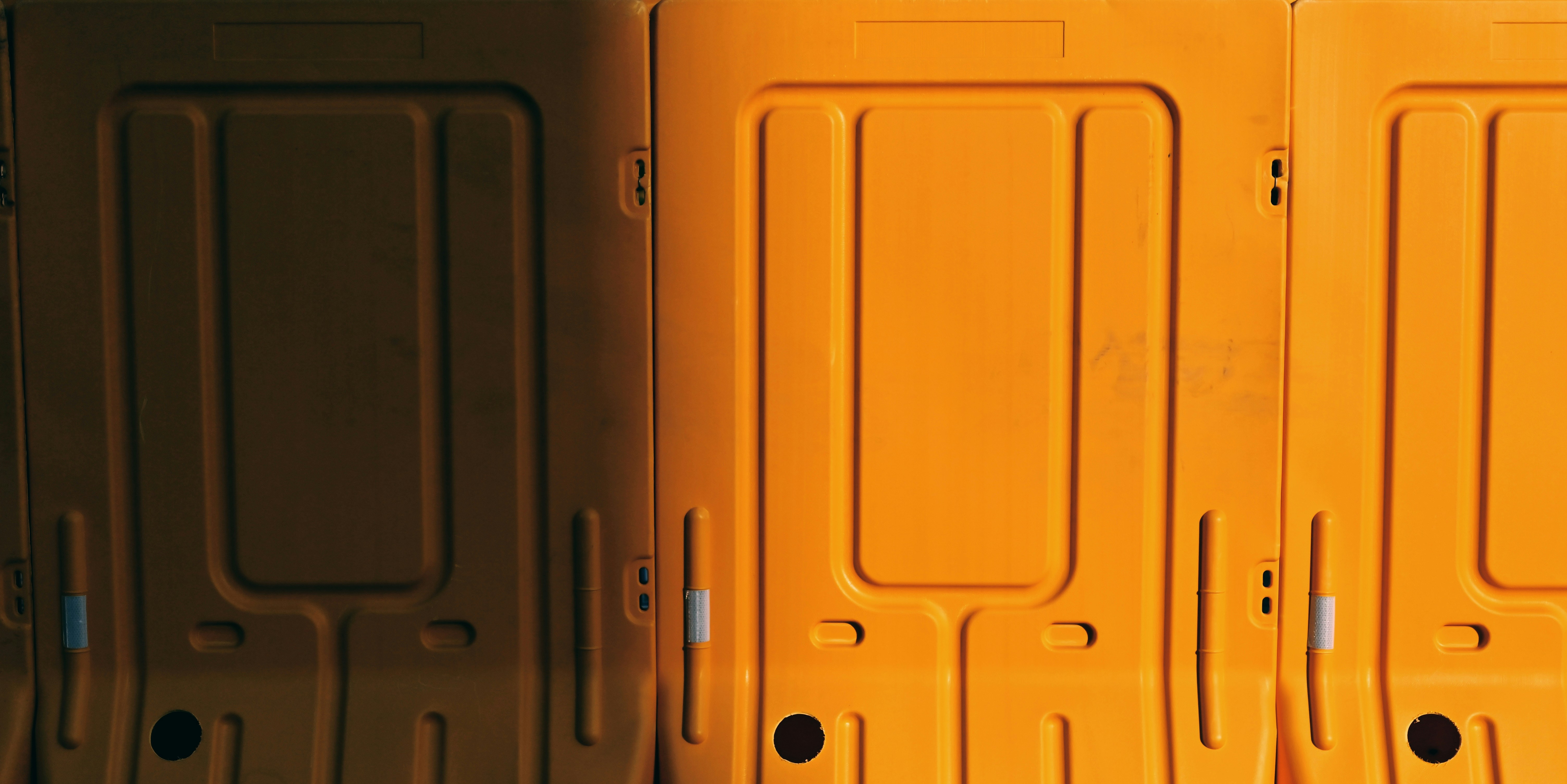 a row of yellow suitcases sitting next to each other