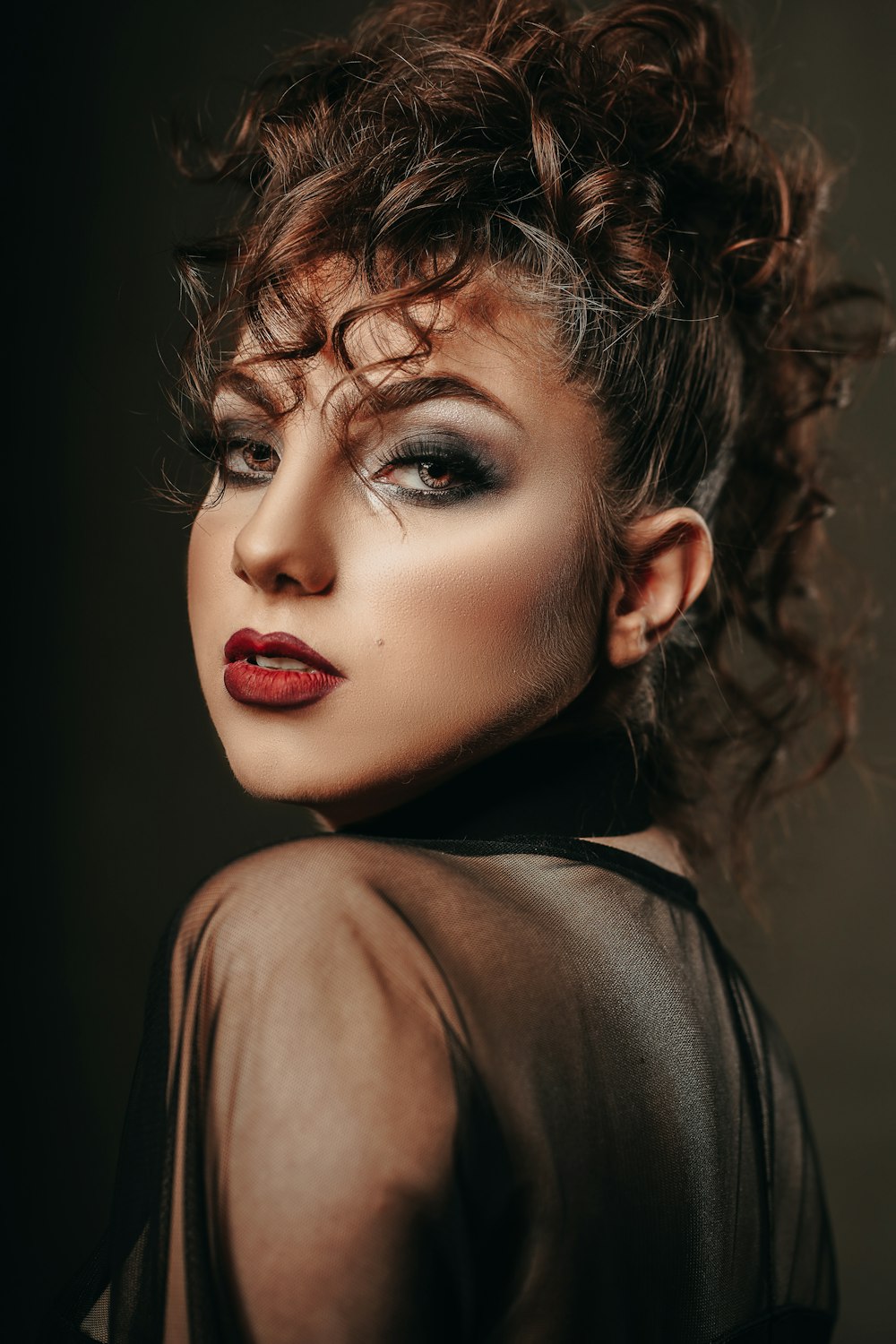 a close up of a person wearing a black dress