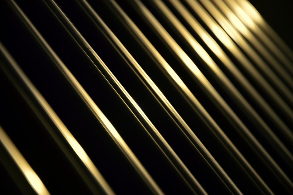 a close up of a black and gold background