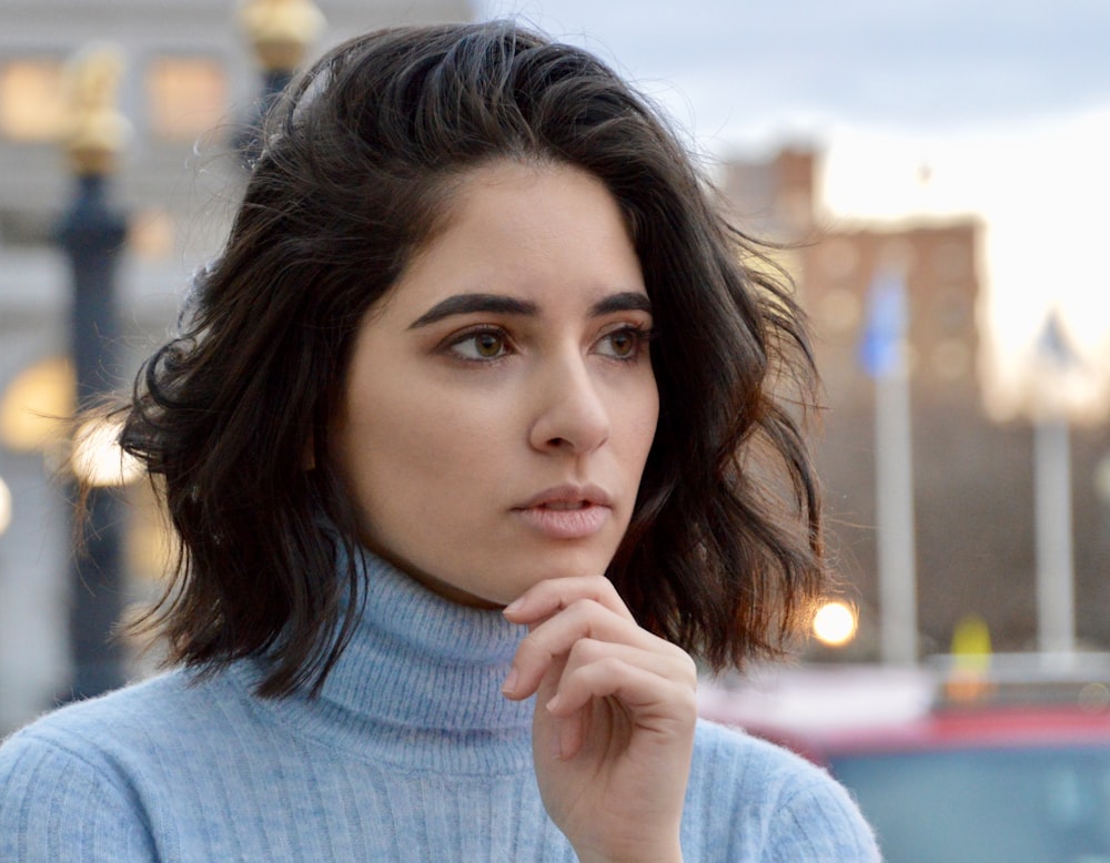 a close up of a person wearing a sweater