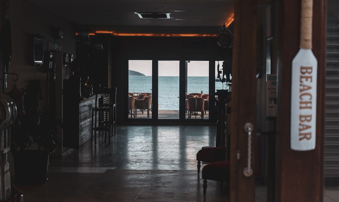 a hallway leading to a beach side restaurant,