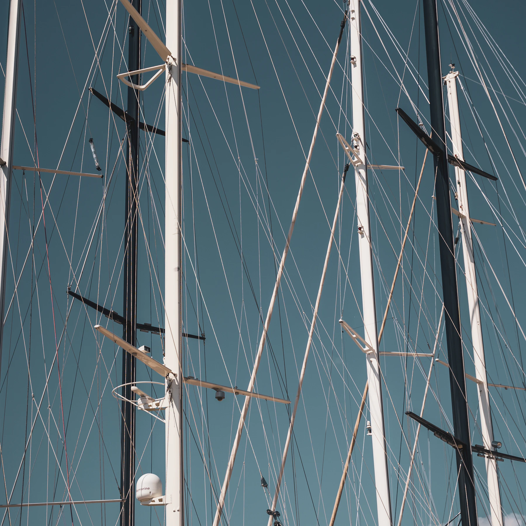 Rigging against the sky on a moored sailing boat.