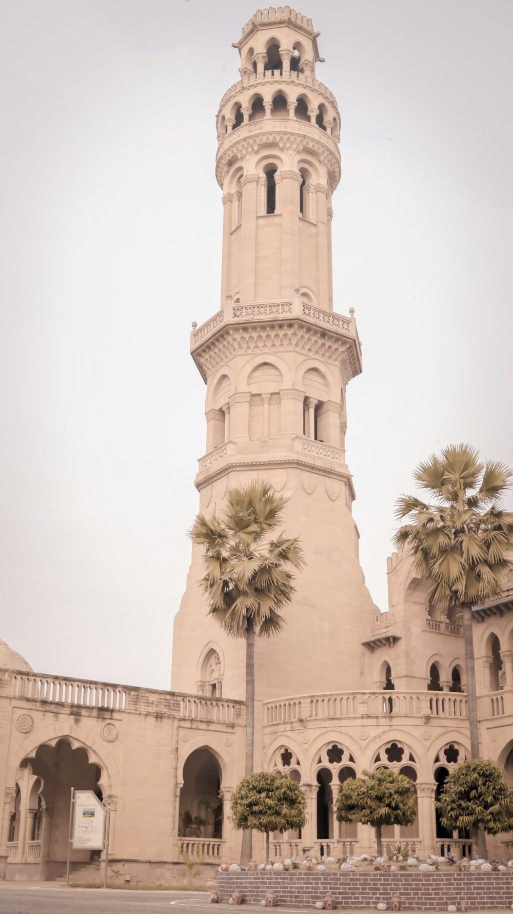 a tall tower with a clock on the top of it