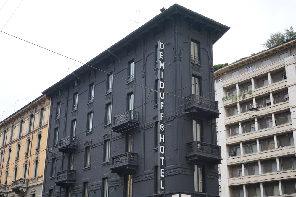 a black building with a sign that reads oneida hotel