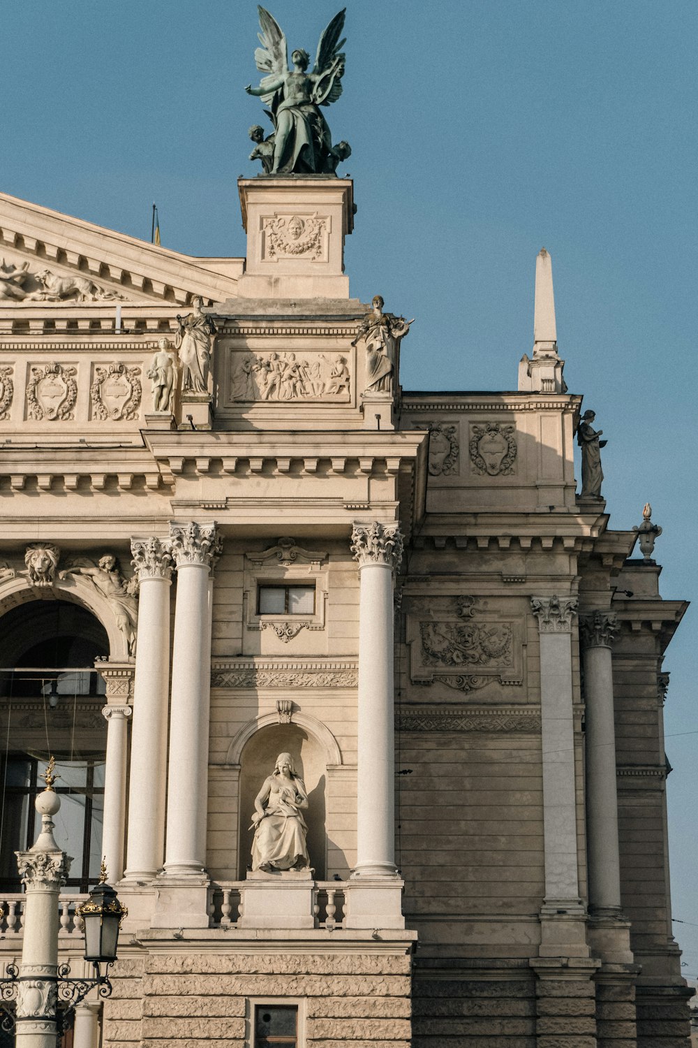 a statue in front of a building