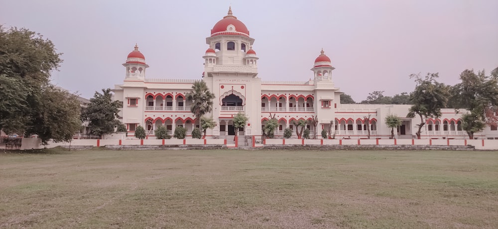 a large white building with red and white domes