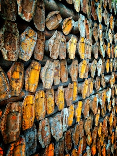 A collection of metal corner brackets stacked neatly, highlighting their sturdy build.