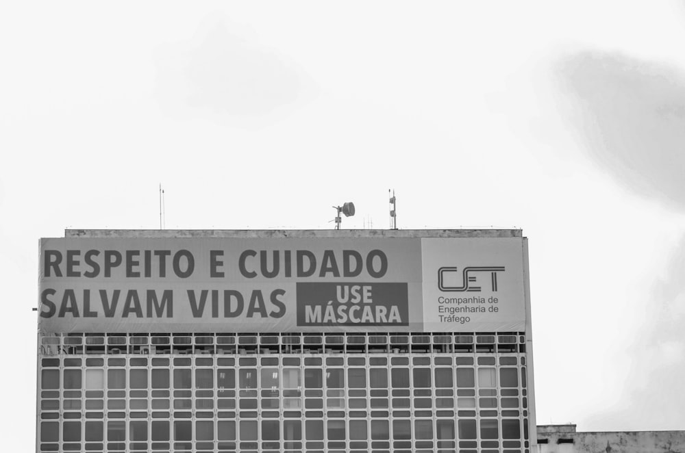 a tall building with a sign on the side of it