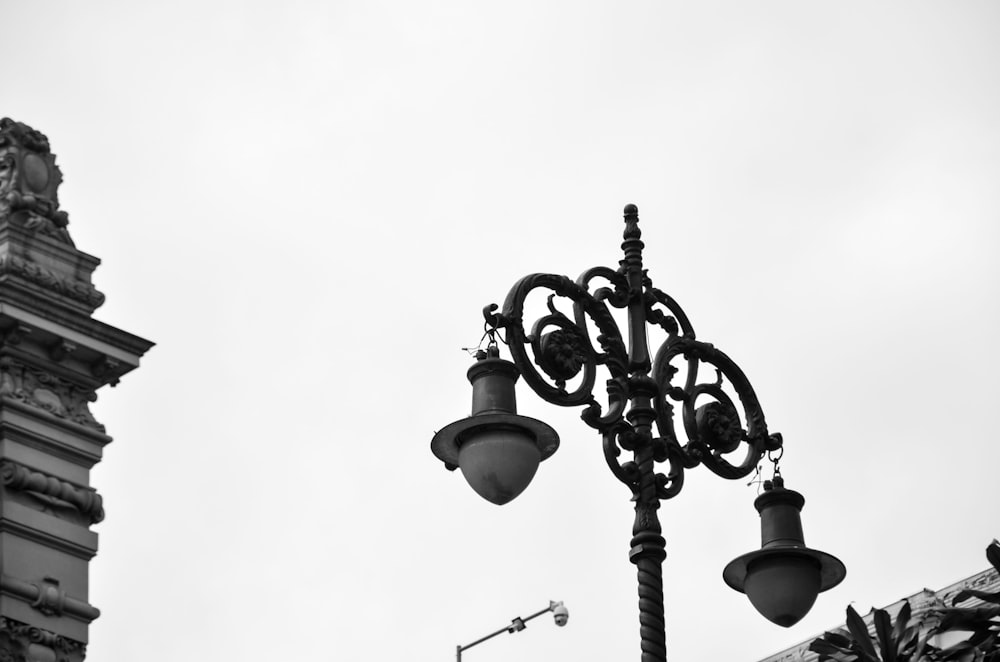 a black and white photo of a street light