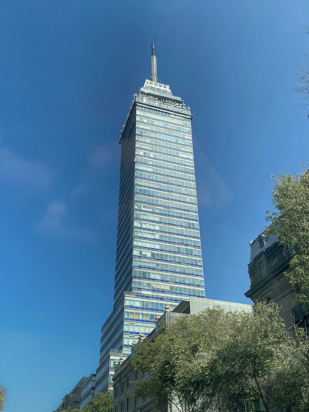 a tall building with a sky scraper in the background