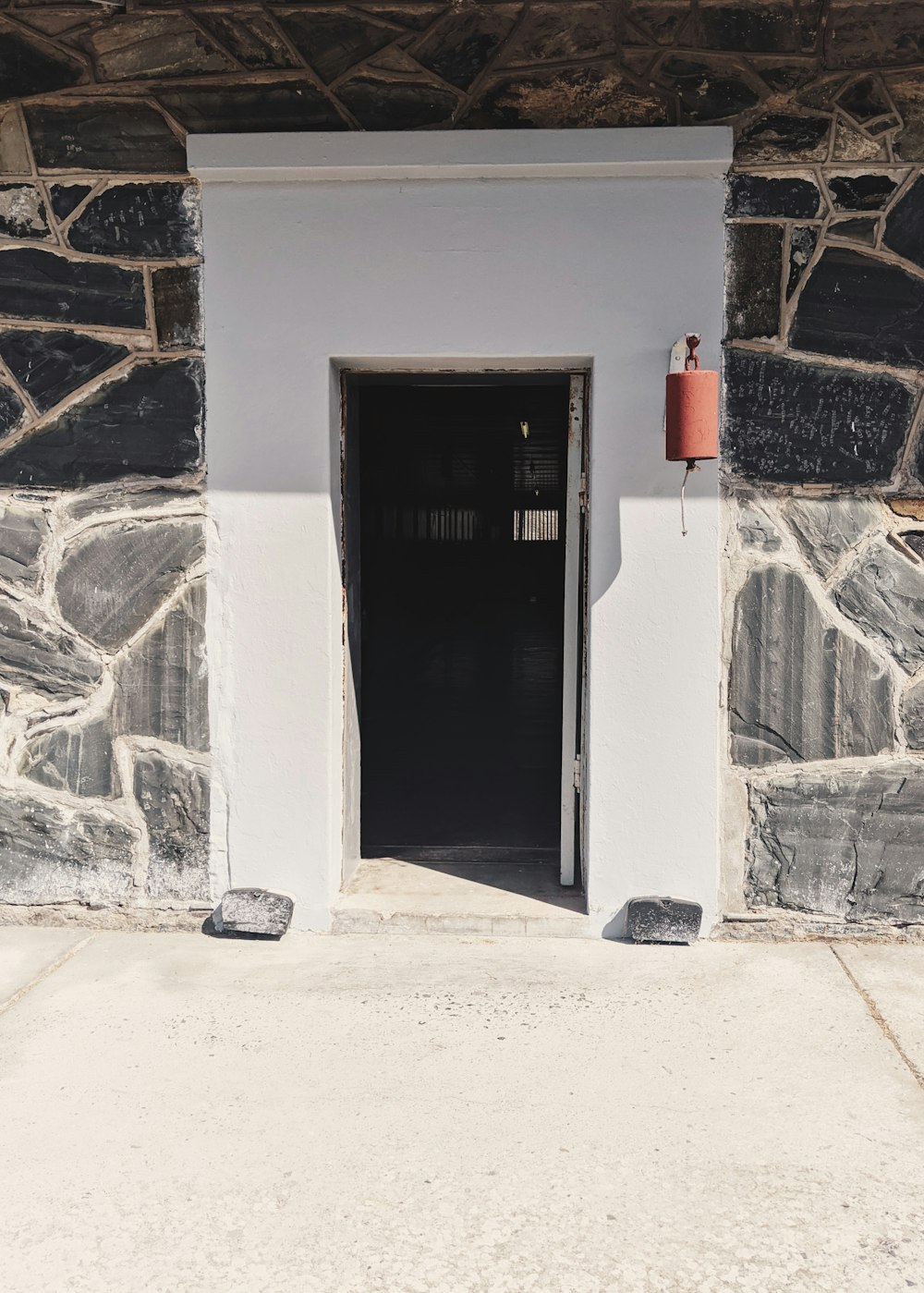 a door is open in a stone building