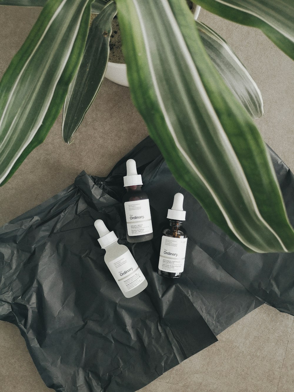 a group of bottles sitting on top of a black bag