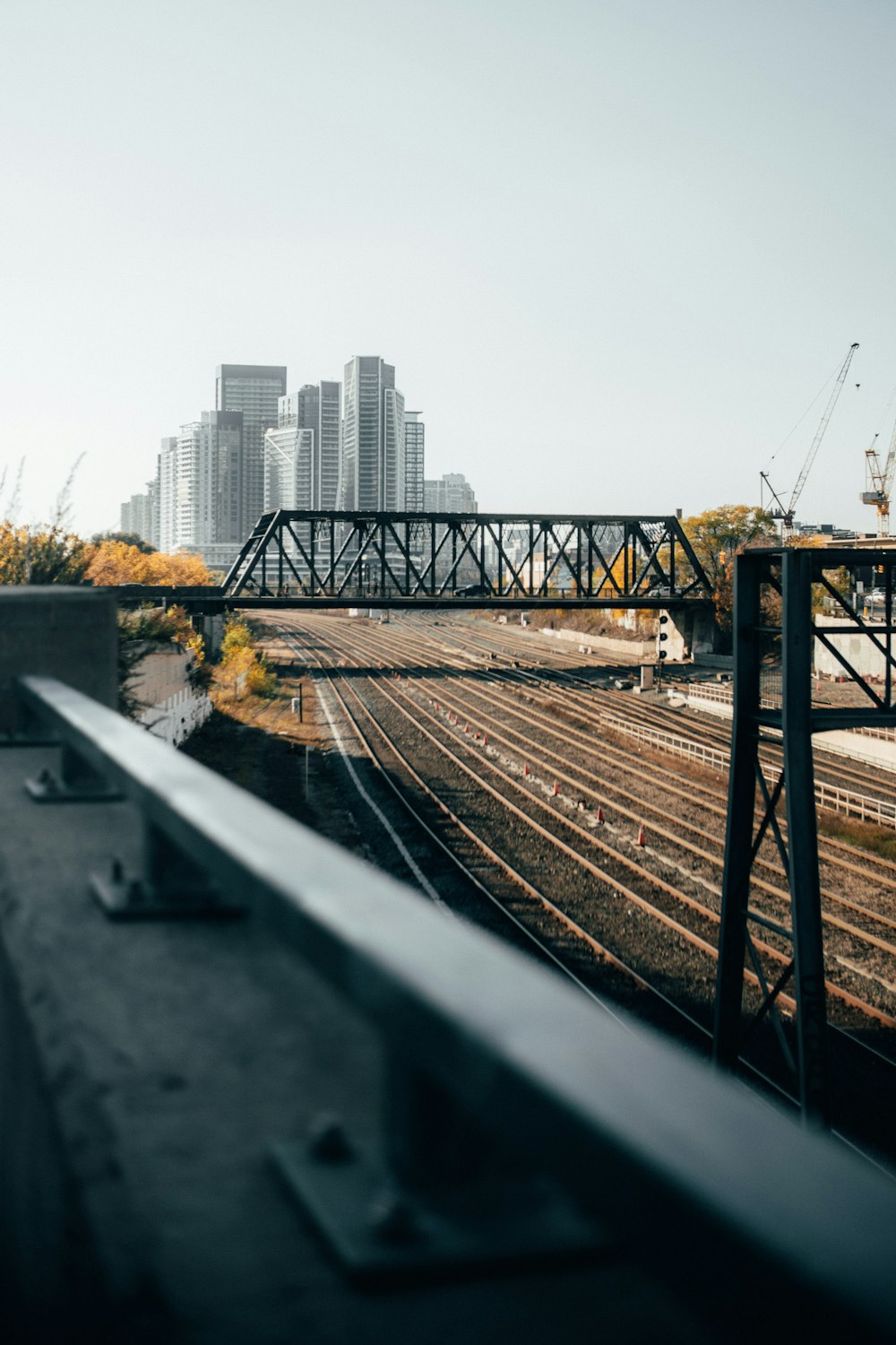 a view of a train track and a city skyline