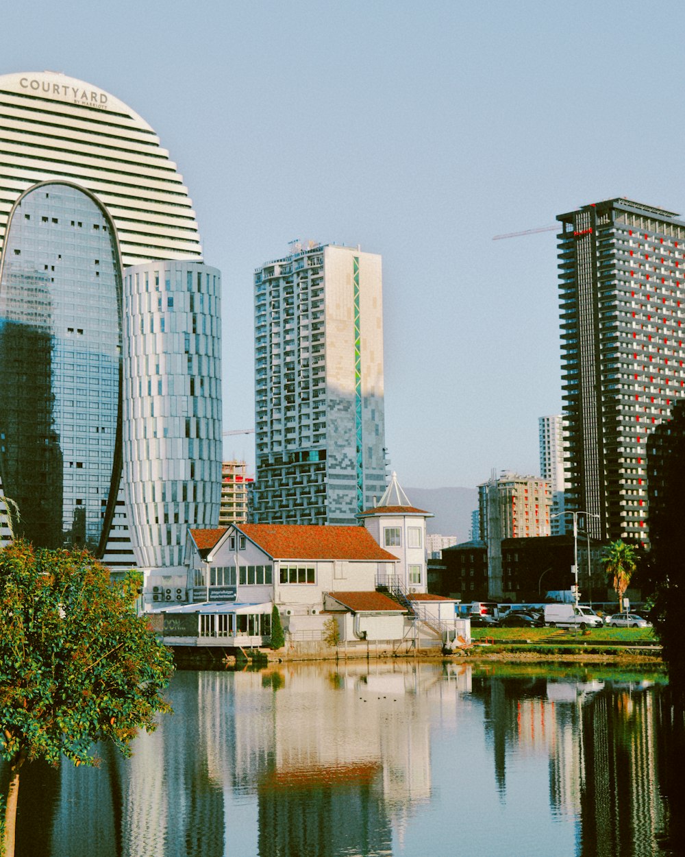 a body of water surrounded by tall buildings