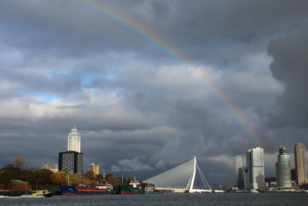 a rainbow in the sky over a city