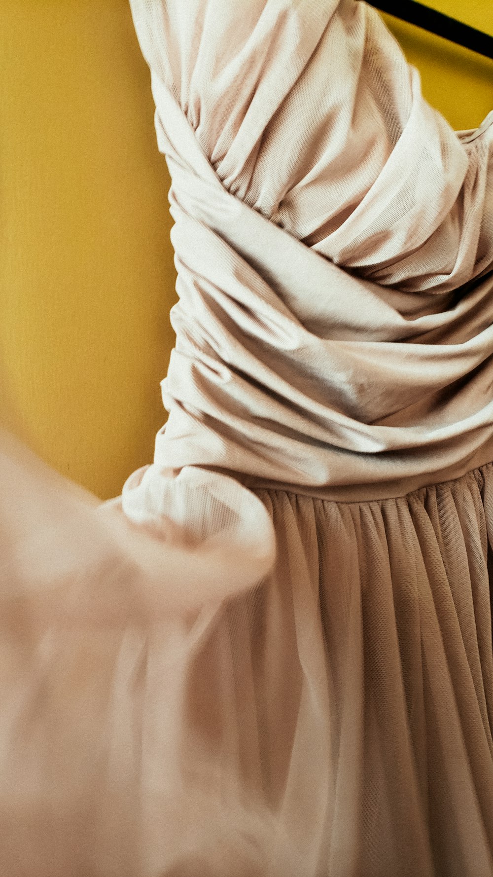 a close up of a dress on a hanger
