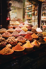 A vibrant display of various health supplements and organic spices arranged on a wooden table.