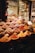 A vibrant display of various spices and herbs in a market setting, featuring bowls and piles overflowing with colorful powders and whole spices. The array is both rich and diverse, capturing the essence of a bustling spice market.