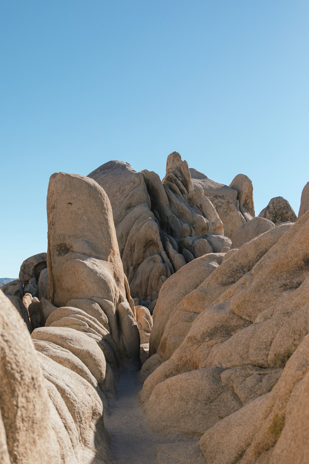 a large rock formation in the middle of a desert