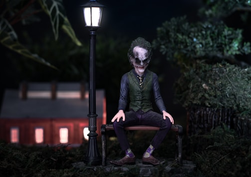 Villain character with a sinister smile in a dark setting.