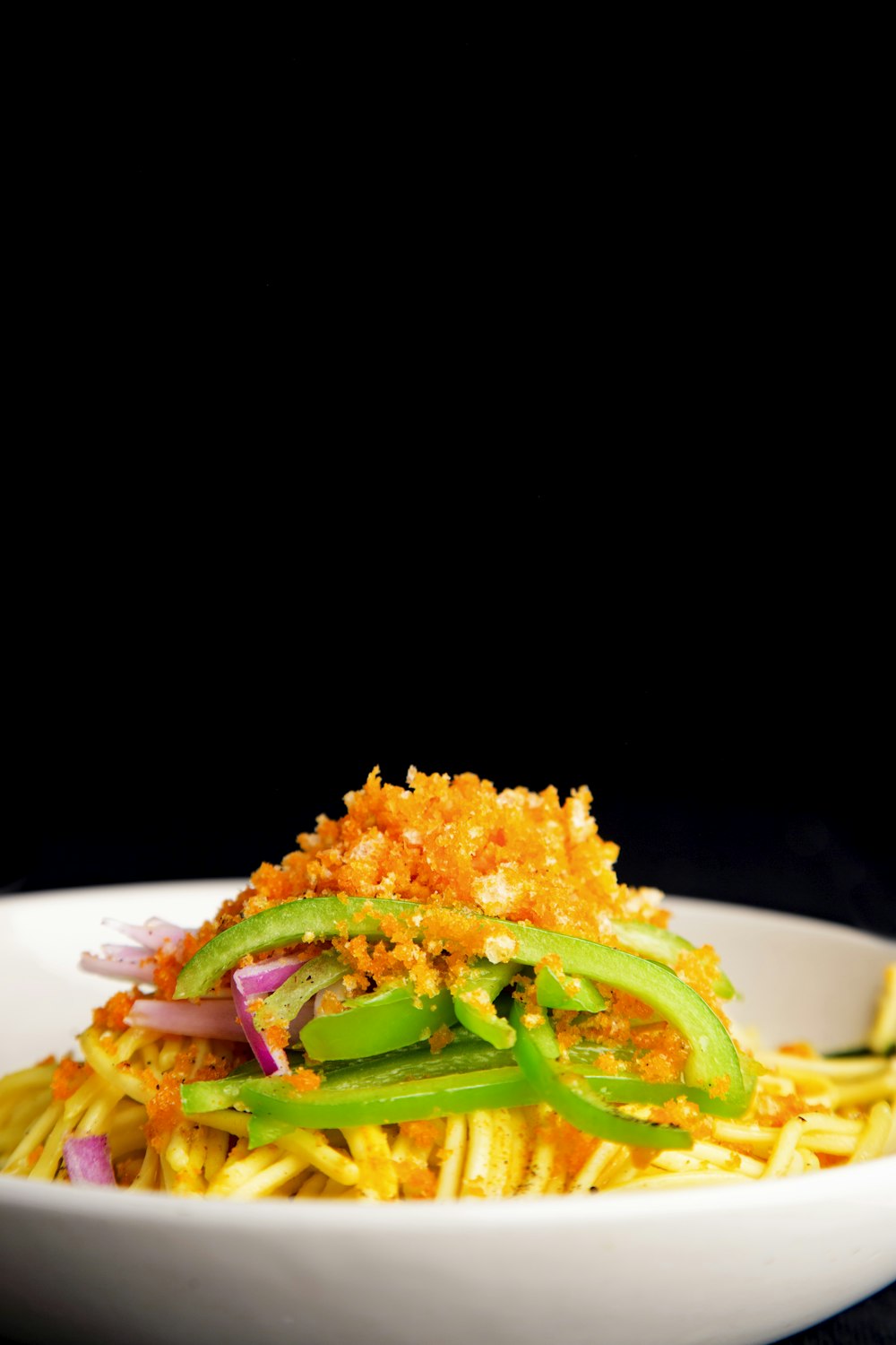 a white bowl filled with food on top of a table