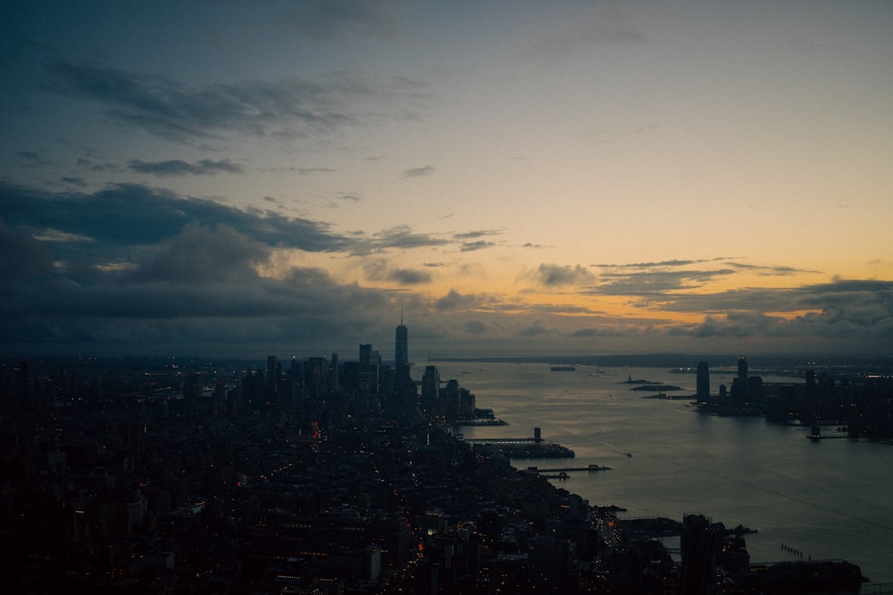 an aerial view of a city at sunset