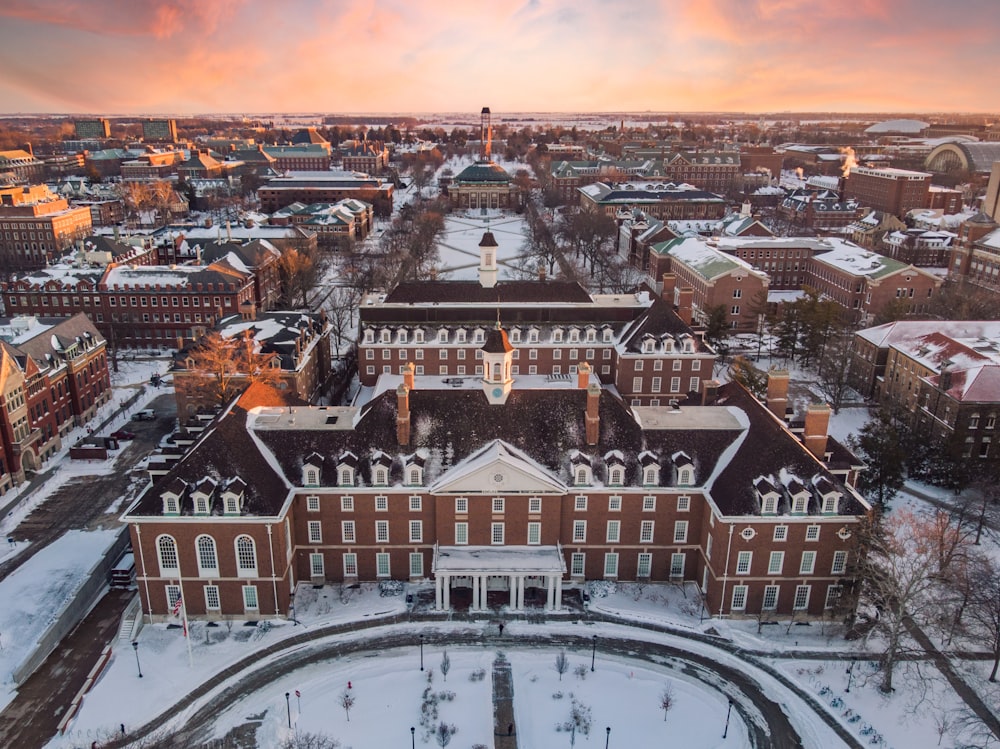 an aerial view of a campus in winter