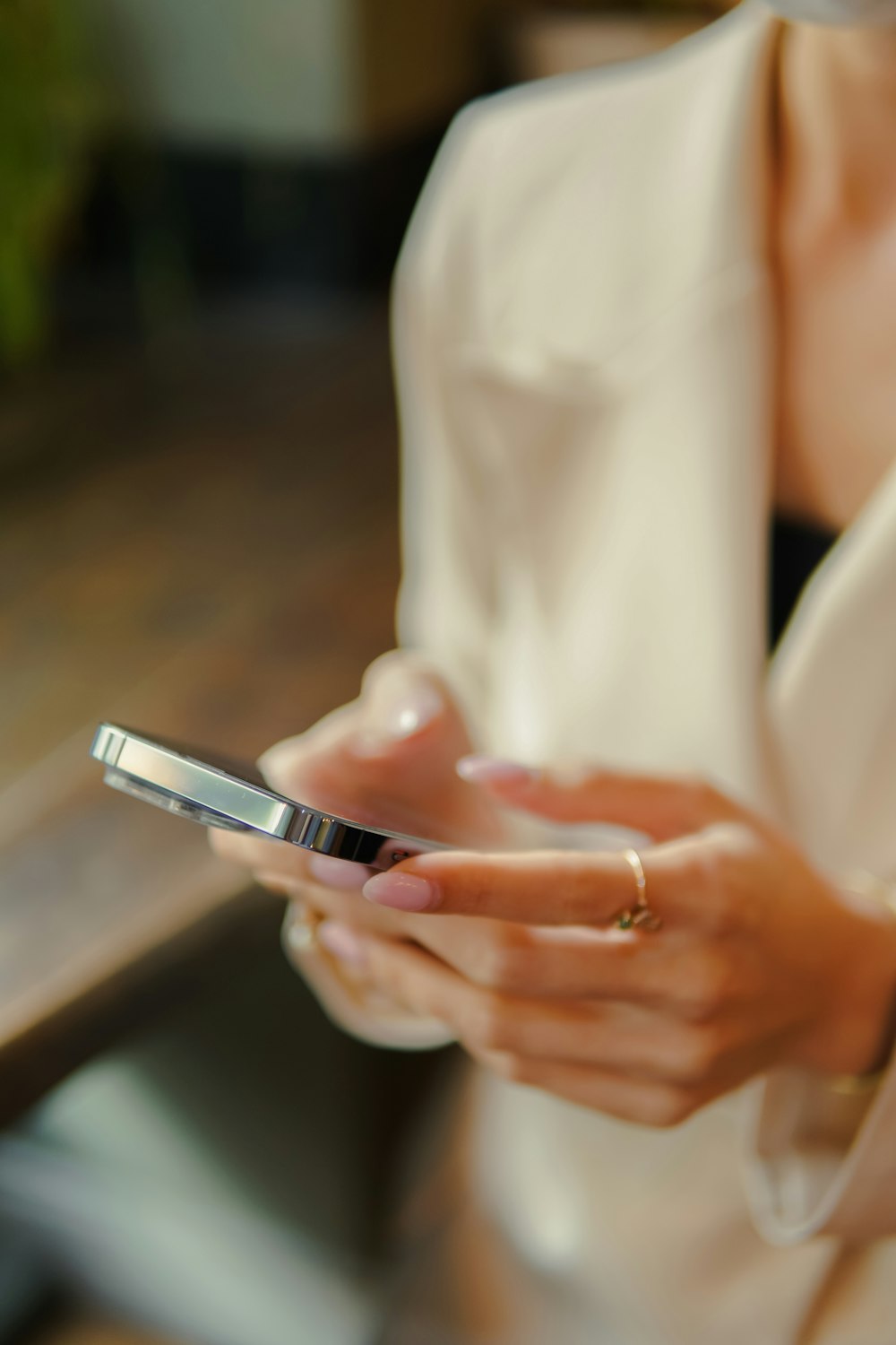 a woman holding a smart phone in her hands