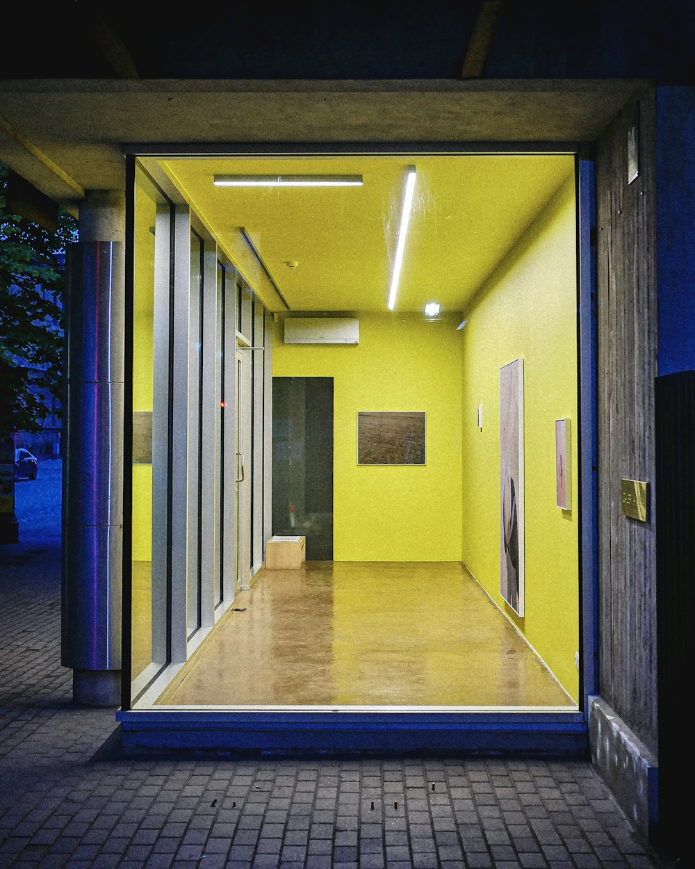 an empty room with yellow walls and doors