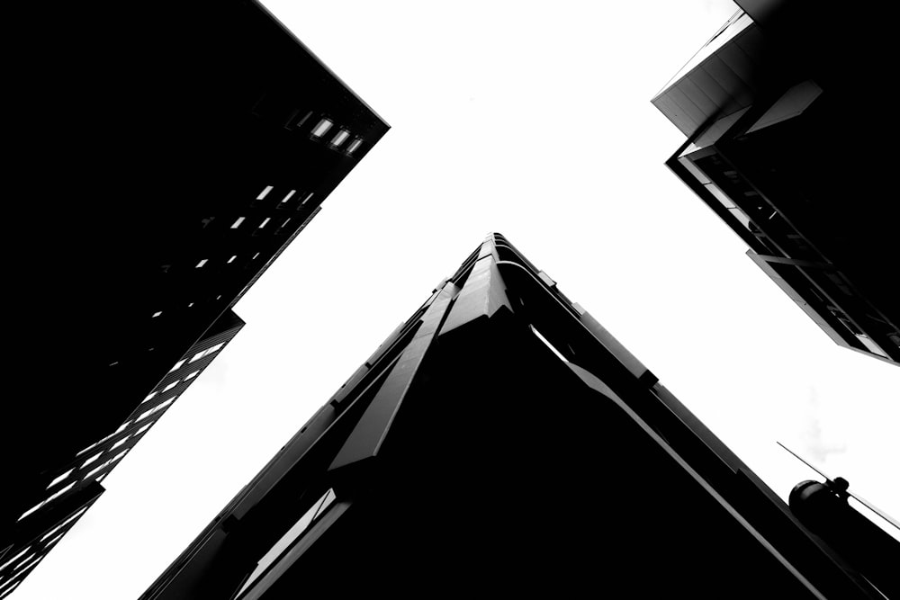 a black and white photo of tall buildings