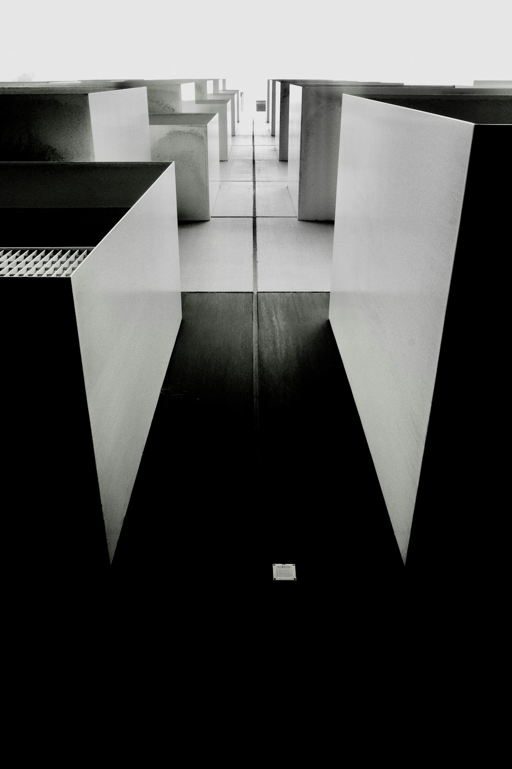 a black and white photo of a hallway