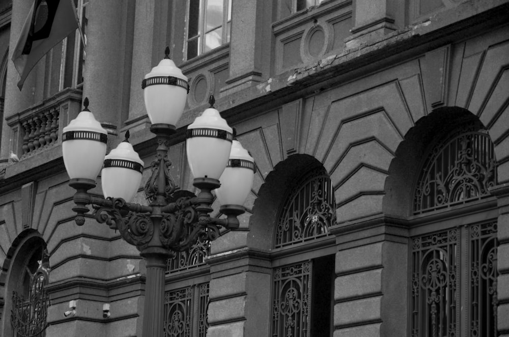 a black and white photo of a street light