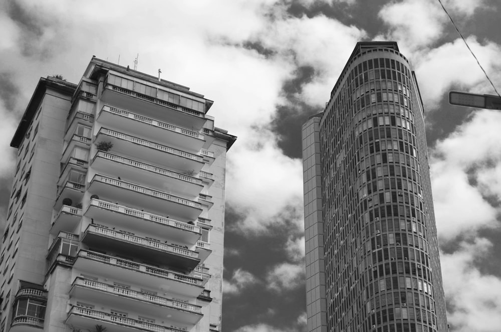 a black and white photo of two tall buildings