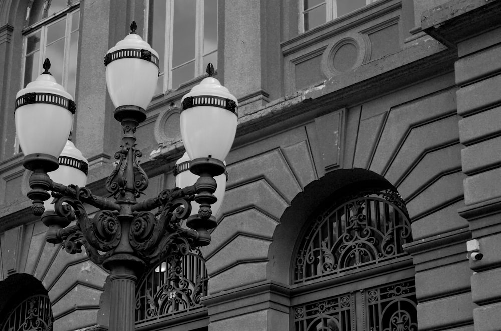 a black and white photo of a street light