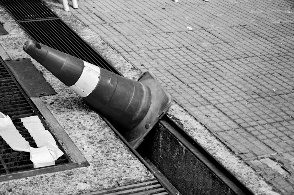 a traffic cone sitting on the side of a road