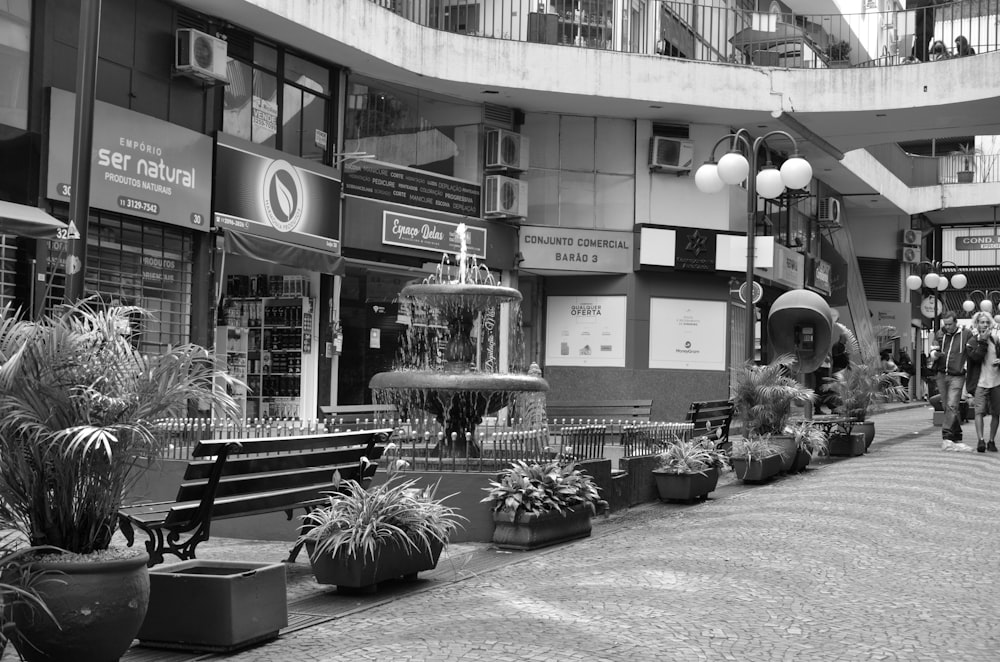 a black and white photo of a shopping mall