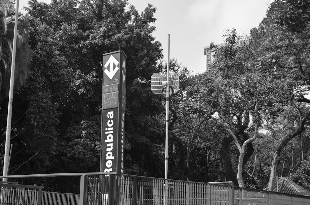 a black and white photo of a sign for a business