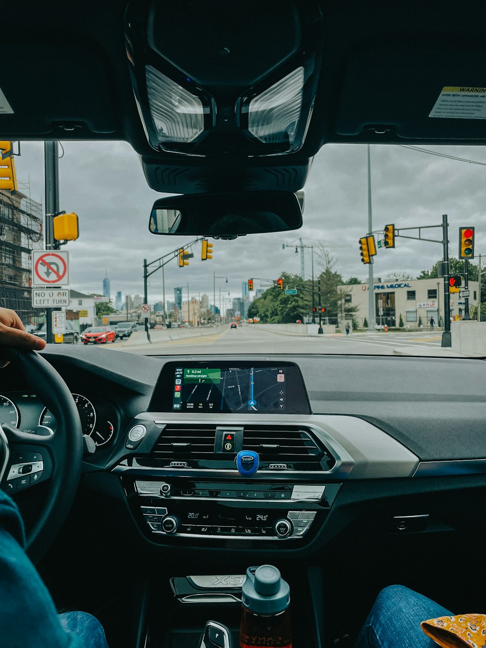 a person driving a car on a city street