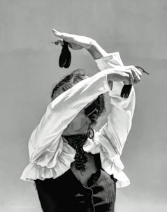 Close-up of flamenco dancer's hands clapping in traditional style.