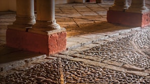 Detail of expertly installed stone flooring on a villa patio, highlighting craftsmanship.
