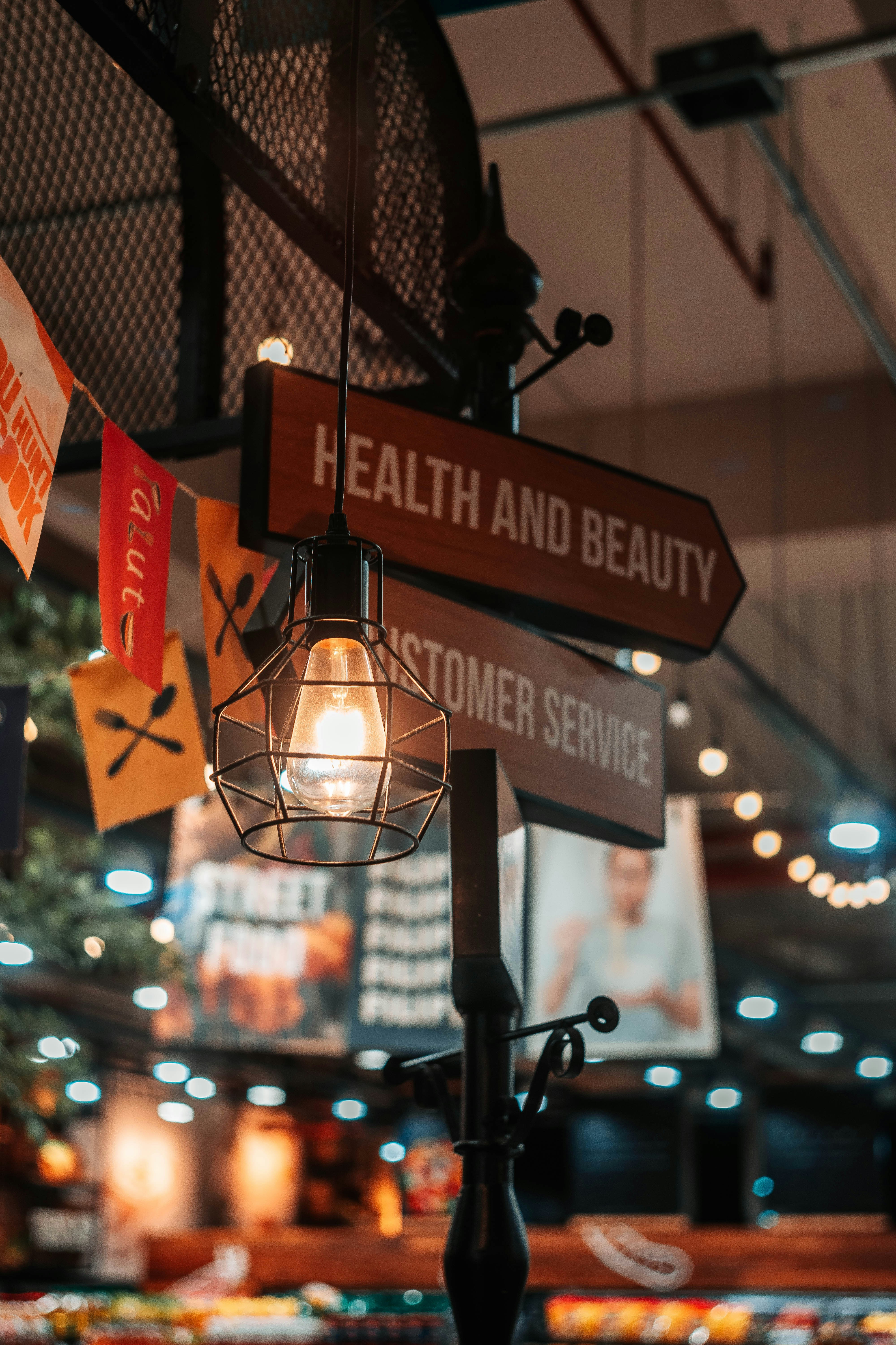 a street sign with a light hanging from it's side