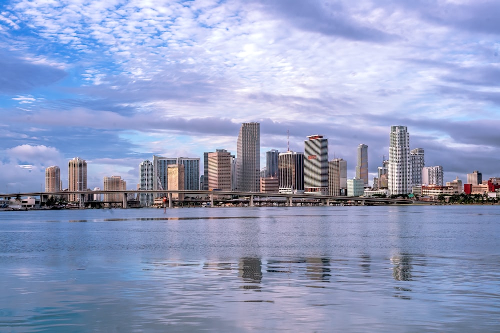 a large body of water with a city in the background