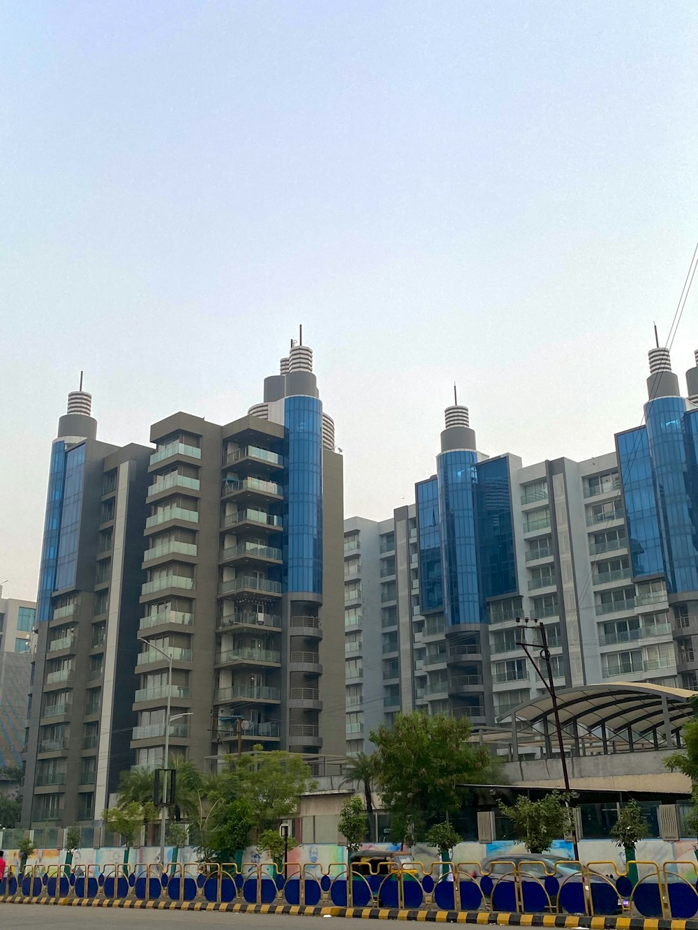 a large building with many windows next to a street