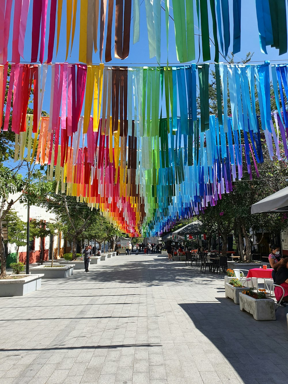 a street lined with lots of colorful streamers
