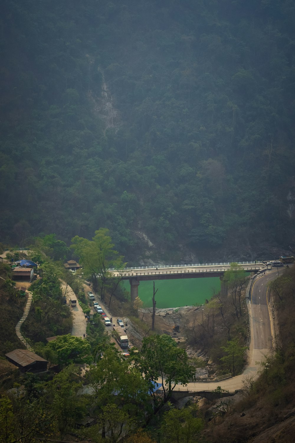 a scenic view of a road and a bridge