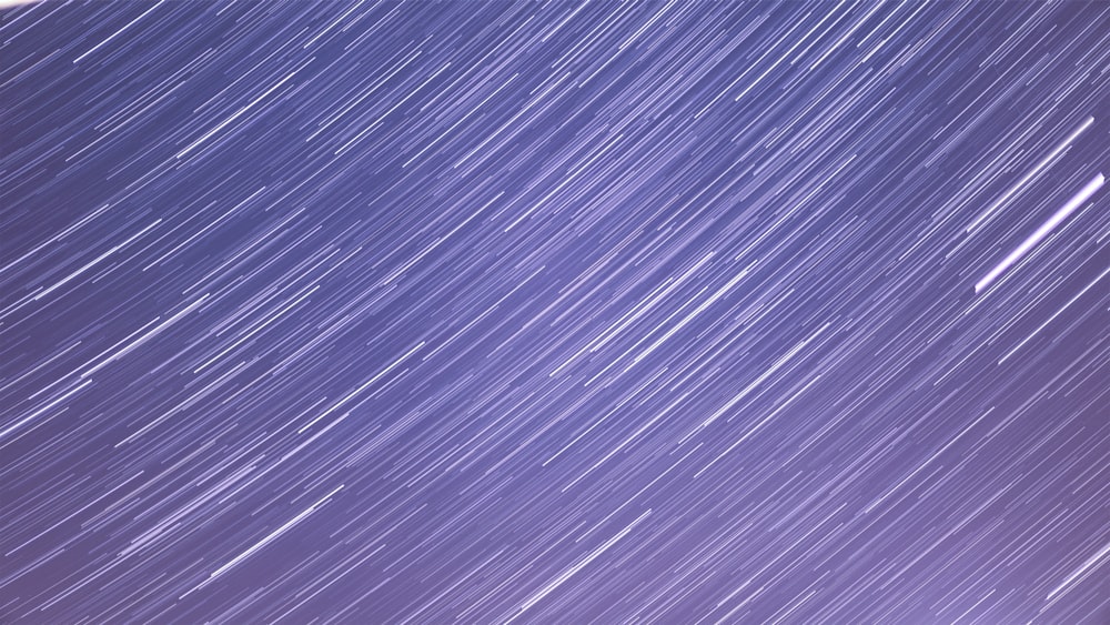 a star trail is seen in the night sky