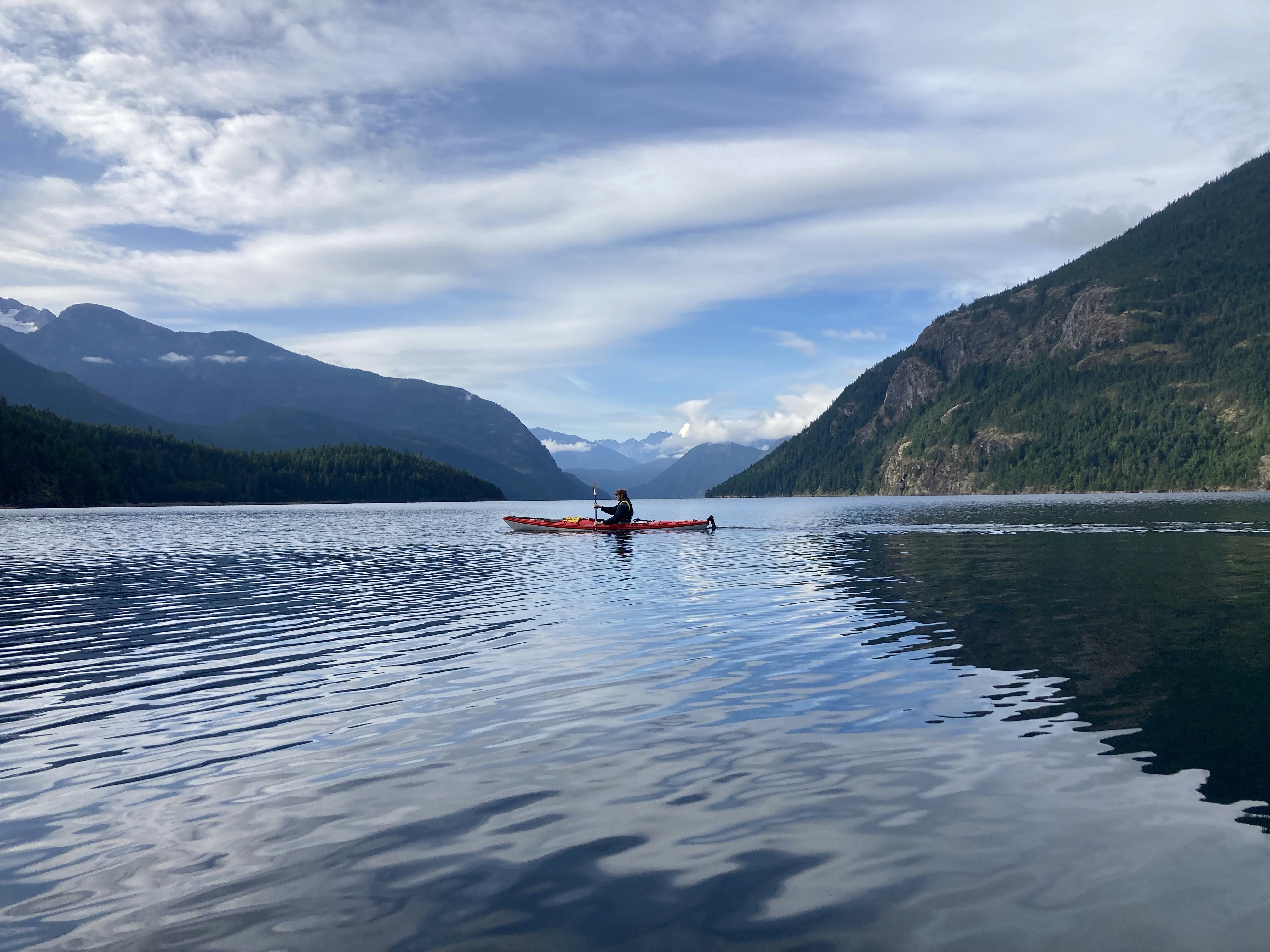 A kayak on a turquoise lake.