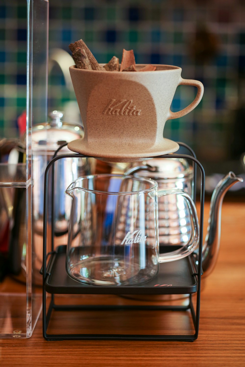 a stack of coffee cups sitting on top of a wooden table